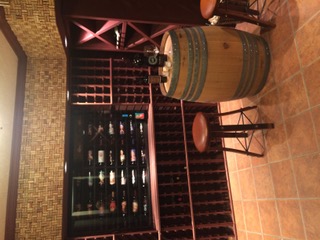 Wine Cellar with Mosaic Tile & Barrel Table